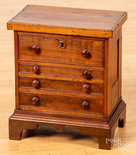 Miniature walnut chest of drawers, 19th c.