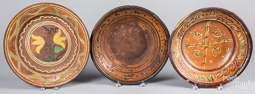 Three redware chargers, 19th c.