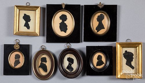 Eight antique silhouettes.