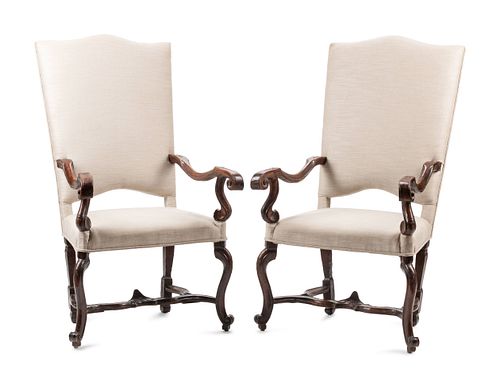 A Pair of Regence Carved Walnut Fauteuils