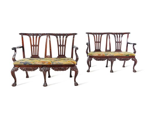 A Pair of Irish George II Style Carved Mahogany Double-Back Settees