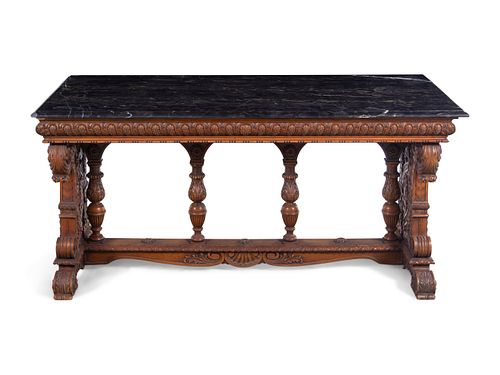 A Karpen Renaissance Revival Carved Oak Marble-Top Table