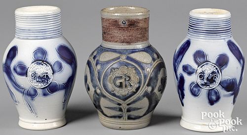 Two Staffordshire salt glaze stoneware GR jugs