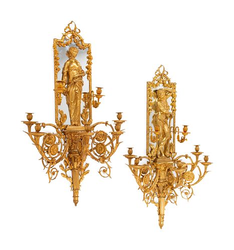 A Pair of Large Louis XVI Style Mirrored Gilt Bronze Figural Sconces