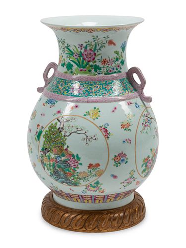 A Chinese Export Style Porcelain Vase on a Carved Giltwood Base