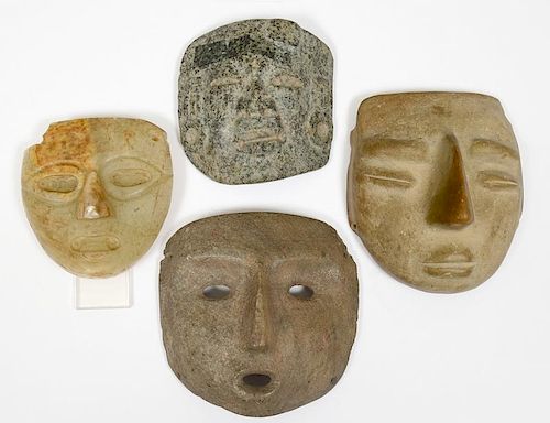 GROUP OF FOUR STONE MASKS