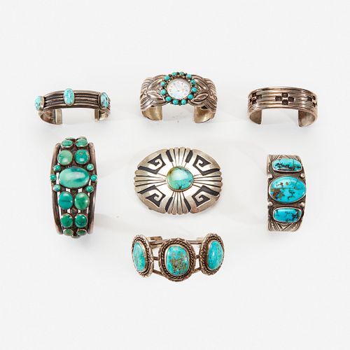 A group of Navajo silver and turquoise bracelet/cuffs and a belt buckle 20th century
