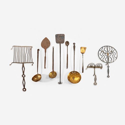 A group of ten wrought iron and brass fireplace cooking items 18th/19th century