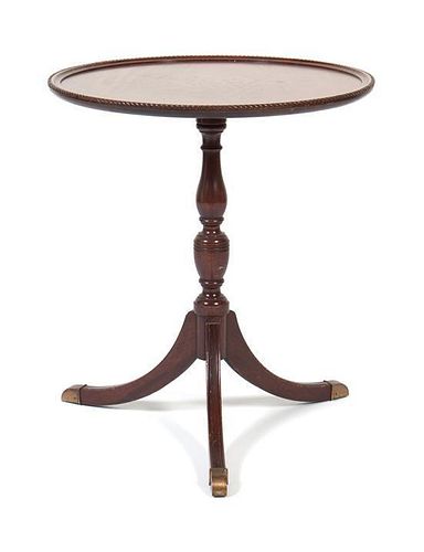 A Side Table Height 26 1/2 x diameter 23 inches.