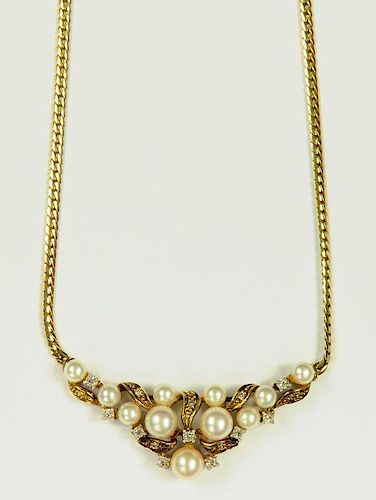 A CULTURED PEARL AND DIAMOND NECKLET ON INTEGRAL GOLD CHAIN, MARKED 375