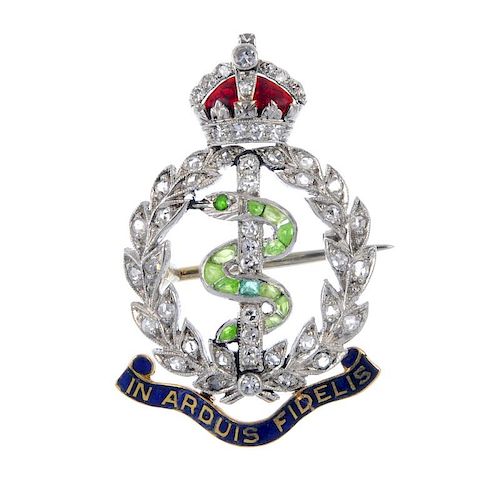 An early 20th century diamond, gem-set and enamel Royal Army Medical Corps brooch. The green gem and