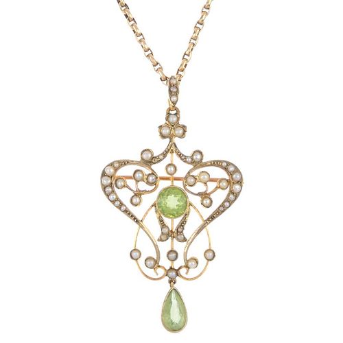 An early 20th century 15ct gold peridot and split pearl pendant. The circular-shape peridot, within