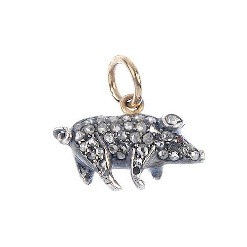 A diamond and gem-set pig pendant. Designed as a standing pig, set throughout with rose-cut diamonds