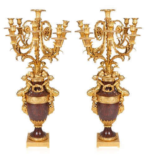 A PAIR OF FRENCH EIGHT-LIGHT LOUIS XVI-STYLE GILT-BRONZE AND ROUGE GRIOTTE MARBLE CANDELABRA, AFTER A MODEL ATTRIBUTED TO FRANCOIS REMOND, CIRCA 1880 