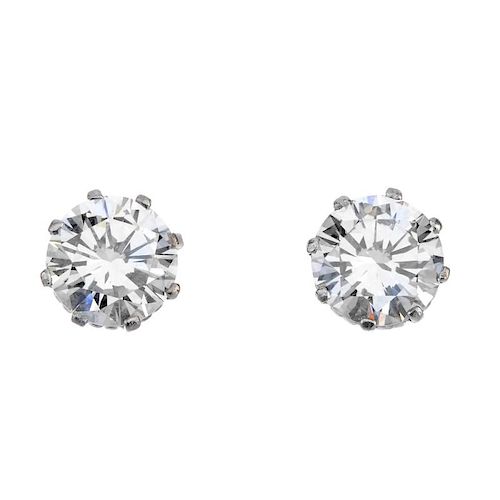 A pair of brilliant-cut diamond ear studs, weighing 2.02 and 2.04cts, respectively. Accompanied by r