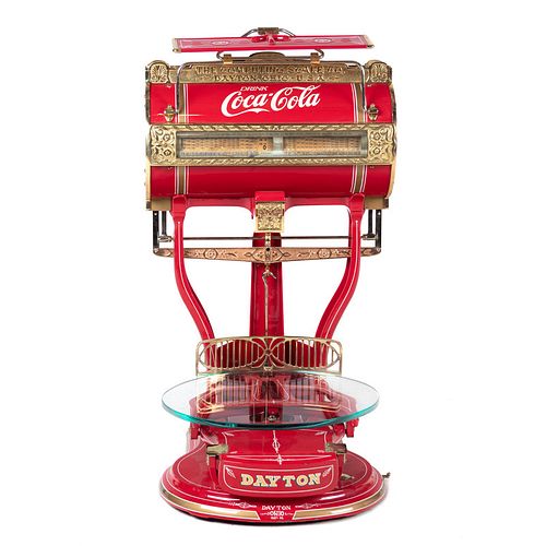 A Red Dayton Computing Scale with Coca-Cola Advertisement