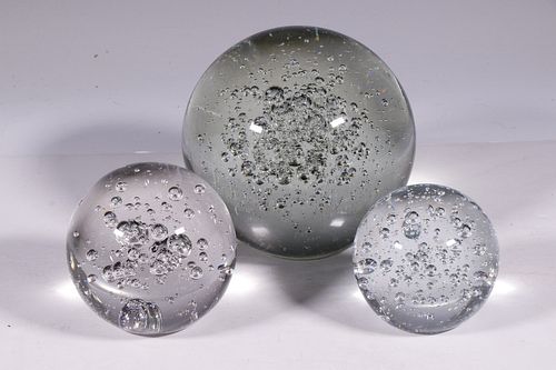 A COLLECTION OF (3) GLASS ROUND SPHERES