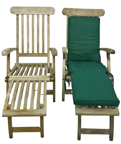 Pair of Outdoor Classics Teak Lounge Chairs having fold up foot rests, length 57 inches.