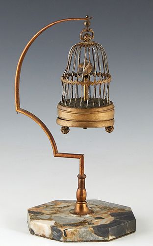 Miniature Brass Bird Cage Annular Clock, early 20th c., on a brass support to an octagonal highly figured marble stand, not running, H.- 11 1/4 in., W