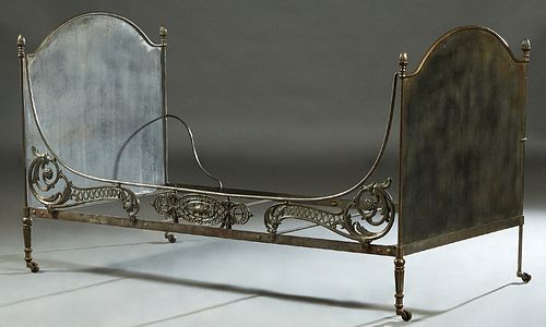 Contemporary Iron Campaign Style Daybed, 20th c., the arched solid head and footboards joined by a pierced floral and scroll front rail and a plain ba