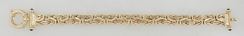 14K Yellow Gold "Wheat" Bracelet, 20th c., the ends with onyx mounted bars, with a maker's mark of a sideways "S" in a diamond, H.- 3/8 in., L.- 8 3/8