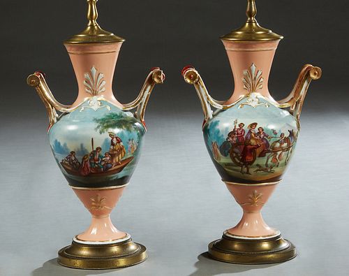 Pair of Old Paris Style Handled Baluster Vases, early 20th c., with reserves of landscapes on one side and traveling families on the other, on a pink 