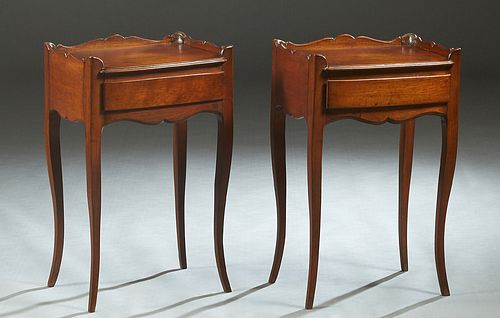 Pair of French Louis XV Style Carved Mahogany Nightstands, early 20th c., the 3/4 galleried top over a frieze drawer, on square tapered cabriole legs,