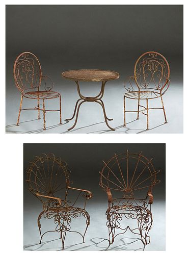 Five Piece Children's Cast Iron Garden Set, 20th/21st c., consisting of a pair of twisted wire fan back armchairs, a pair of side chairs and a circula