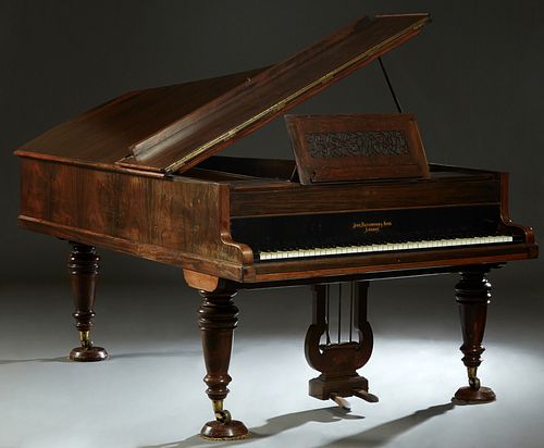 Rosewood Boudoir Grand Piano by John Broadwood, London, c. 1885, the music stand cutout to spell "Broadwood," with 85 keys, on turned tapered legs, H.