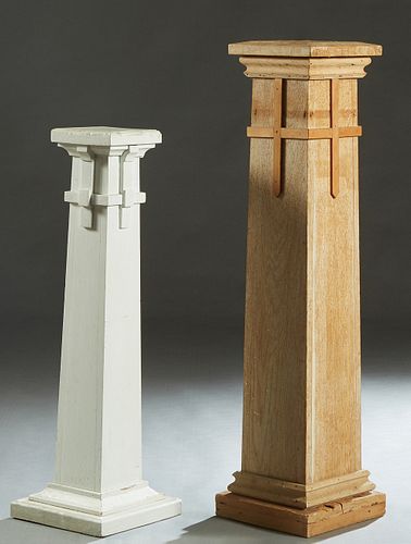 Two Cypress Pedestals, c. 1900, the square tops over square supports with applied cross decoration, on a stepped plinth base, the shorter painted whit