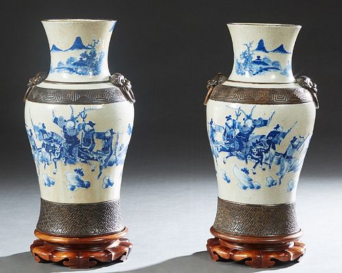 Pair of Chinese Glazed Blue and White Baluster Vases, 20th c., the everted rim over a Greek Key band with applied Foo Lion handles, decorated with pai