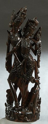 Indonesian Carved Rosewood Figural Group, 20th c., of a King and Queen, carved from a single piece of wood, H.- 32 in., W.- 9 1/2 in., D.- 3 1/2 in.