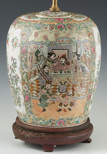 Chinese Famille Rose Covered Jar, late 19th c., painted with floral and interior scene panels, now on a carved mahogany base and mounted as a lamp, H.