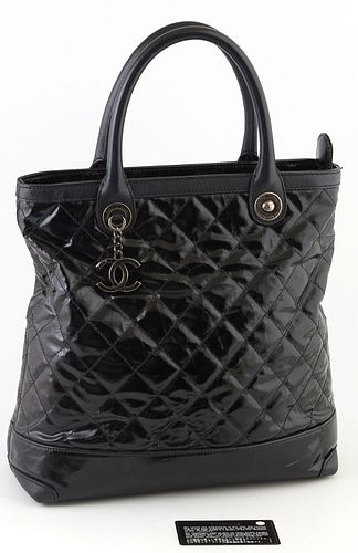 Chanel Black Patented Quilted Leather Logo Charm Tall Tote Handbag, the brushed silver hardware and logo charm, opening to a burgundy interior with ke