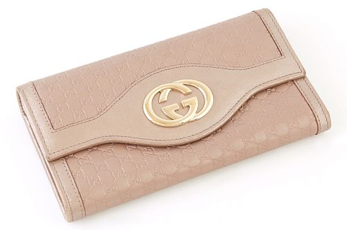Gucci Metallic Light Pink Micro Guccissima Leather Sukey Continental Wallet, the calf leather with a golden brass Gucci logo on front, opening to two 