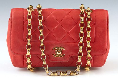Chanel Red Leather Quilted Purse, with gold hardware, the interior of the bag lined in matching red leather with an open side compartment and a zip cl