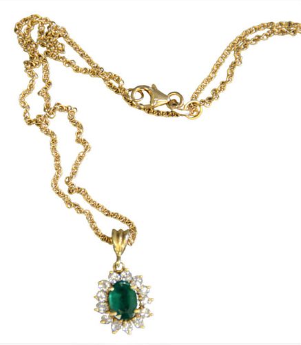 14 Karat Gold Chain, having pendant mounted with oval emerald surrounded by diamonds, emerald 5.8mm x 8.7mm, 16 t.oz..