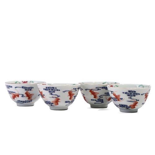 FOUR BLUE AND WHITE AND COPPER RED CUPS