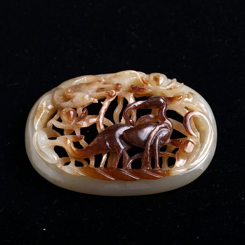 A WHITE AND RUSSET JADE CARVING