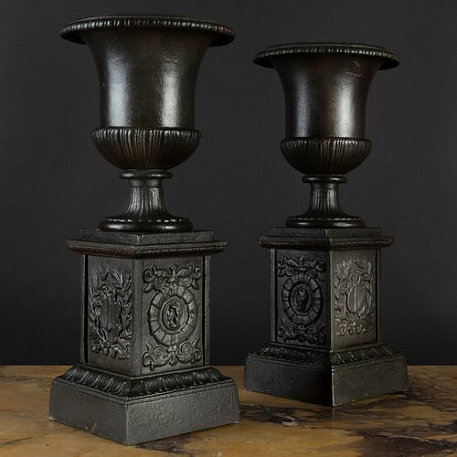 Pair of Black Painted Cast Iron Urns on Pedestals