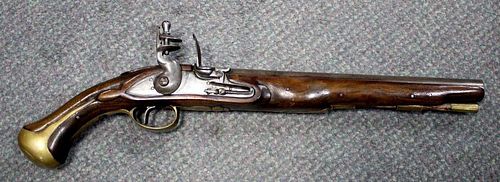 <p>A flintlock holster pistol, with walnut stock, unsigned lock, brass furniture, ramrod possibly la