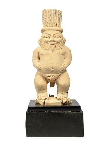 An Egyptian Painted Limestone Bes
Height 5 inches.