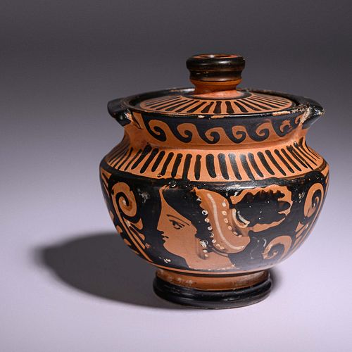 An Apulian Red-Figured Lidded Pyxis
Height 3 1/2 inches.