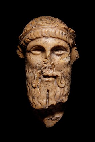 A Roman Giallo Antico Marble Herm Head of Dionysos
Height 6 inches. 