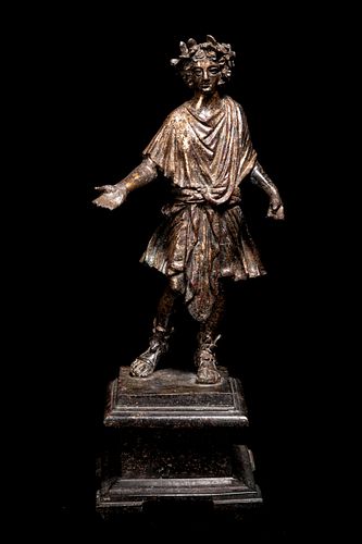 A Roman Gilt Bronze Lar
Height 8 3/4 inches. 