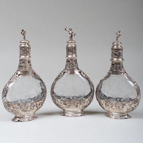 Set of Three Continental Silver Mounted Etched Glass Decanters