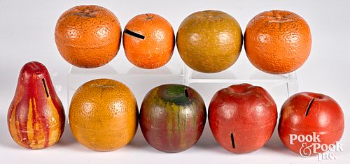 Nine painted redware fruit banks, late 19th c.