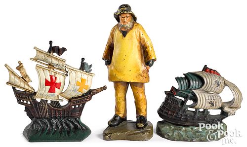 Three painted cast iron doorstops, early 20th c.