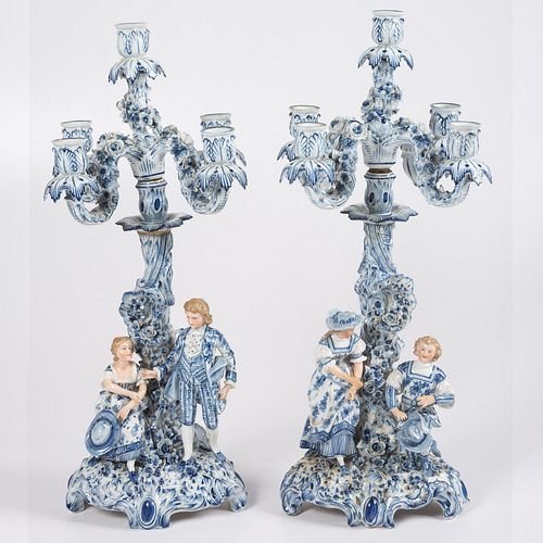 A Pair of German Blue and White Porcelain Four Light Candelabras 