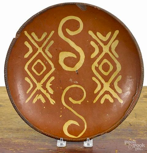 Redware charger, 19th c., with unusual yellow s